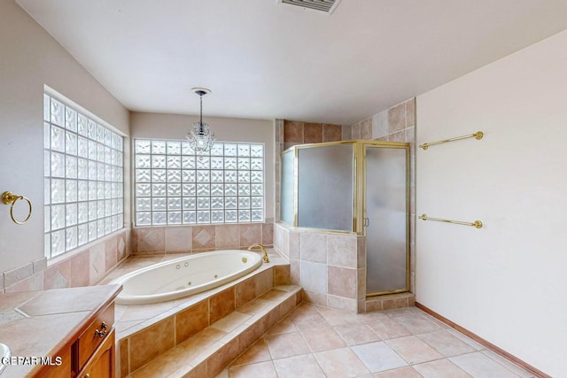 bathroom featuring vanity, shower with separate bathtub, plenty of natural light, and tile patterned flooring