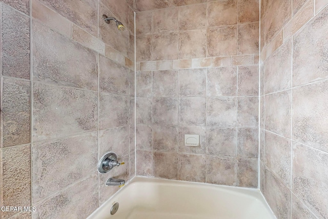 interior details with tiled shower / bath