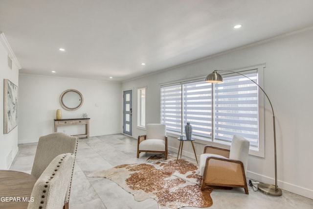 sitting room with ornamental molding