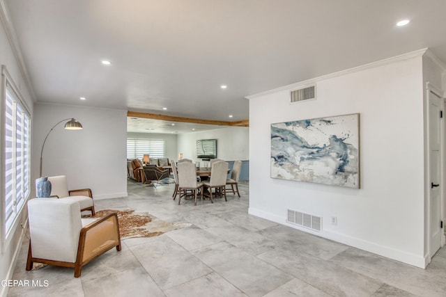 interior space featuring crown molding and a healthy amount of sunlight