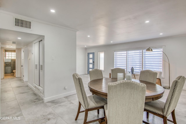 dining area with crown molding