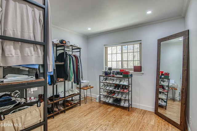 walk in closet featuring light hardwood / wood-style flooring