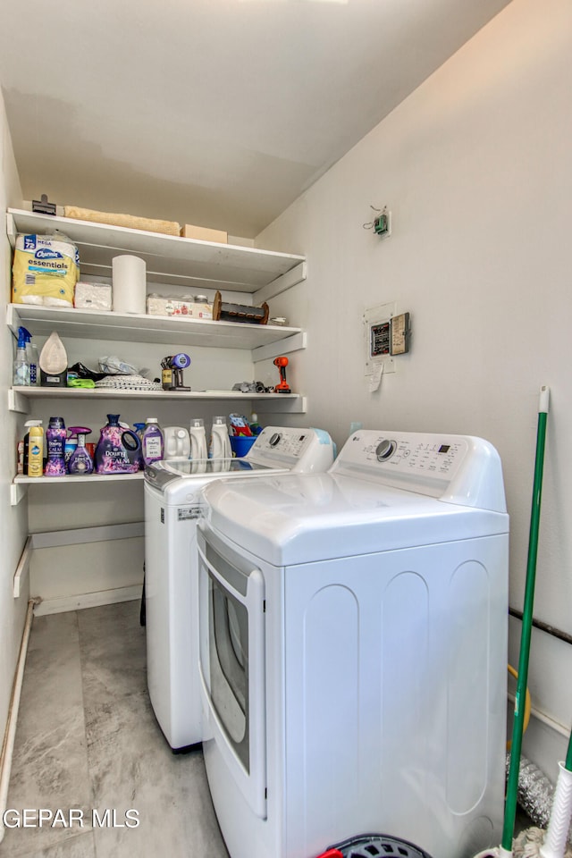 laundry room featuring washing machine and dryer