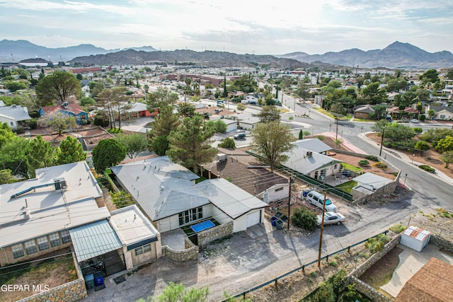 birds eye view of property with a mountain view