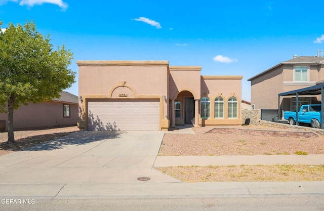 view of front of property with a garage