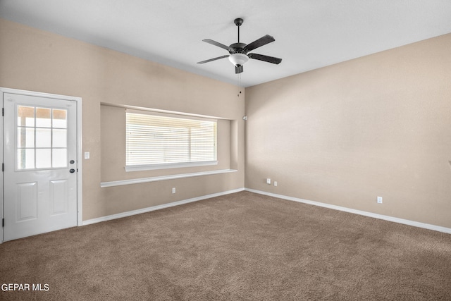 carpeted empty room featuring ceiling fan