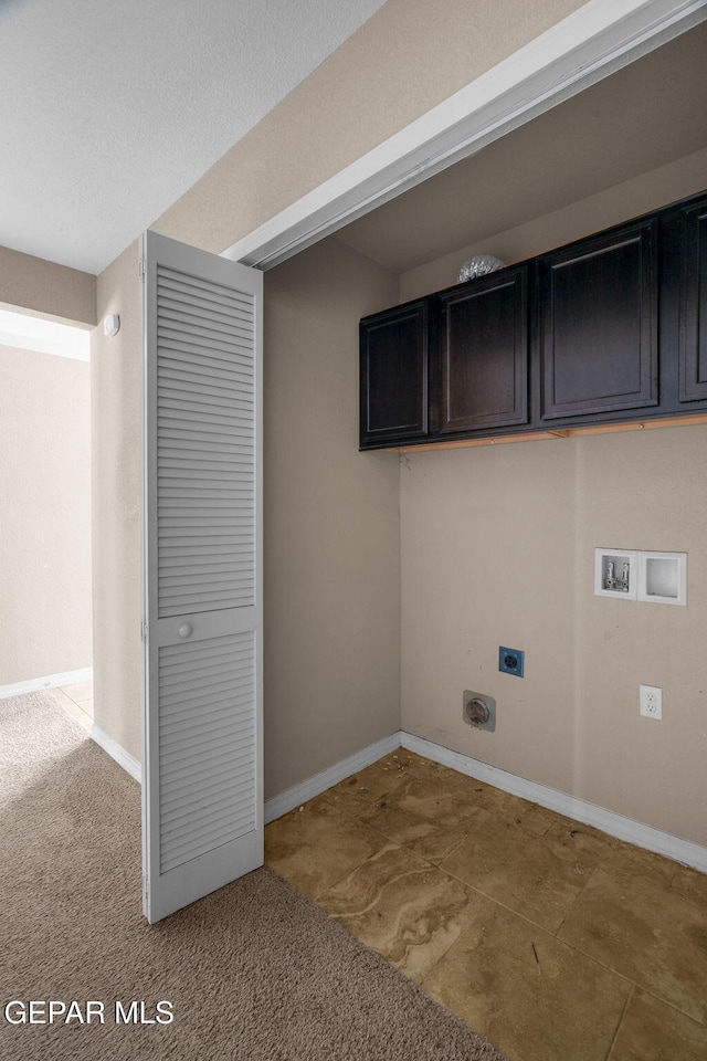 laundry room with cabinets, hookup for a washing machine, light colored carpet, and electric dryer hookup