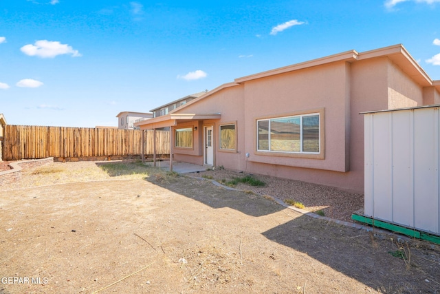 back of house with a patio