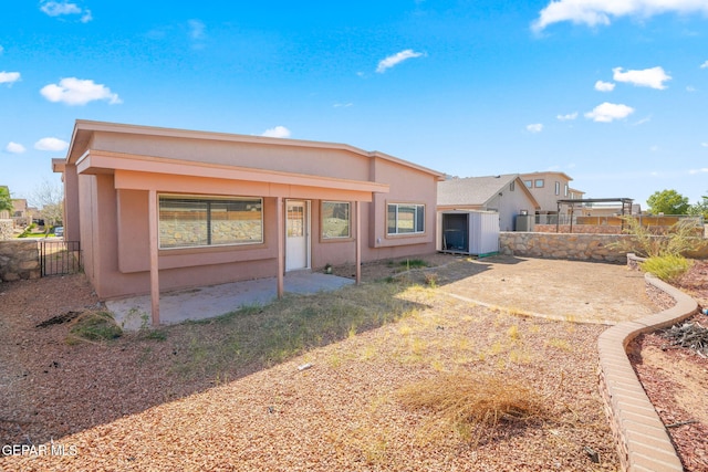 back of property with a patio area