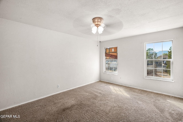 5797 Port Lavaca Dr, El Paso, TX 79924 - unfurnished room with carpet, ceiling fan, baseboards, and a textured ceiling