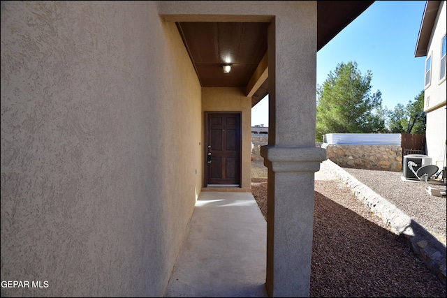 doorway to property with central air condition unit