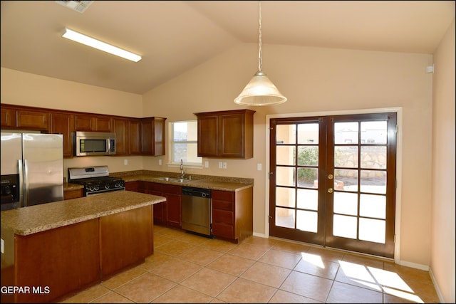 kitchen featuring pendant lighting, stainless steel appliances, a healthy amount of sunlight, and sink