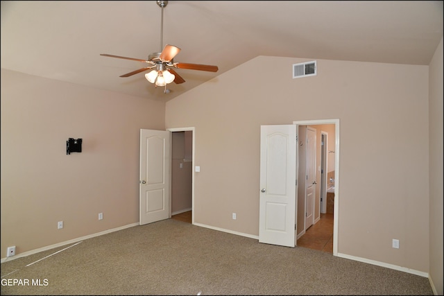 unfurnished bedroom with carpet flooring, ceiling fan, and lofted ceiling