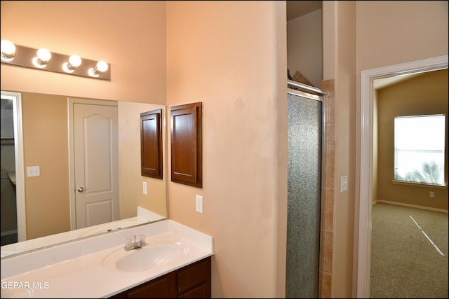 bathroom with vanity and walk in shower