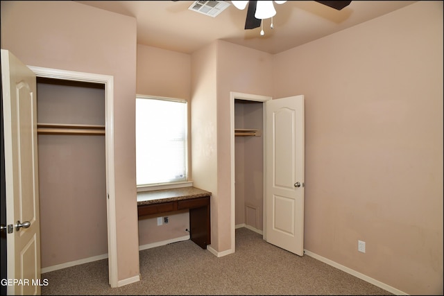 unfurnished bedroom with carpet and ceiling fan