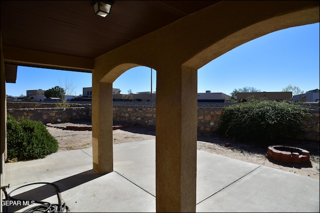 view of patio with an outdoor fire pit