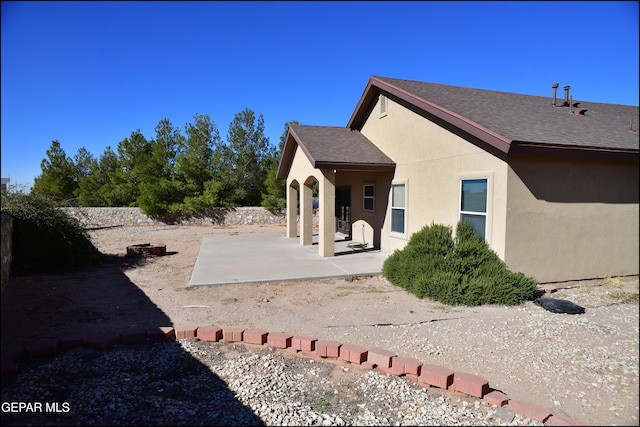 back of house with a patio area