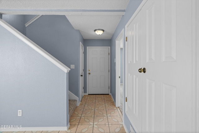 doorway to outside featuring light tile patterned floors