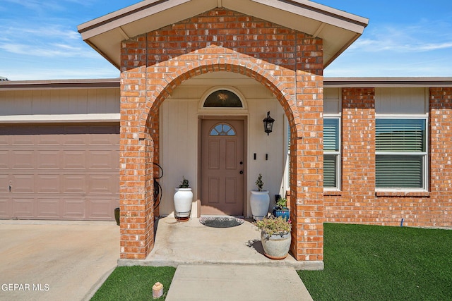 doorway to property featuring a garage