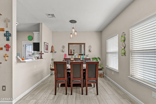 dining area with light wood-type flooring