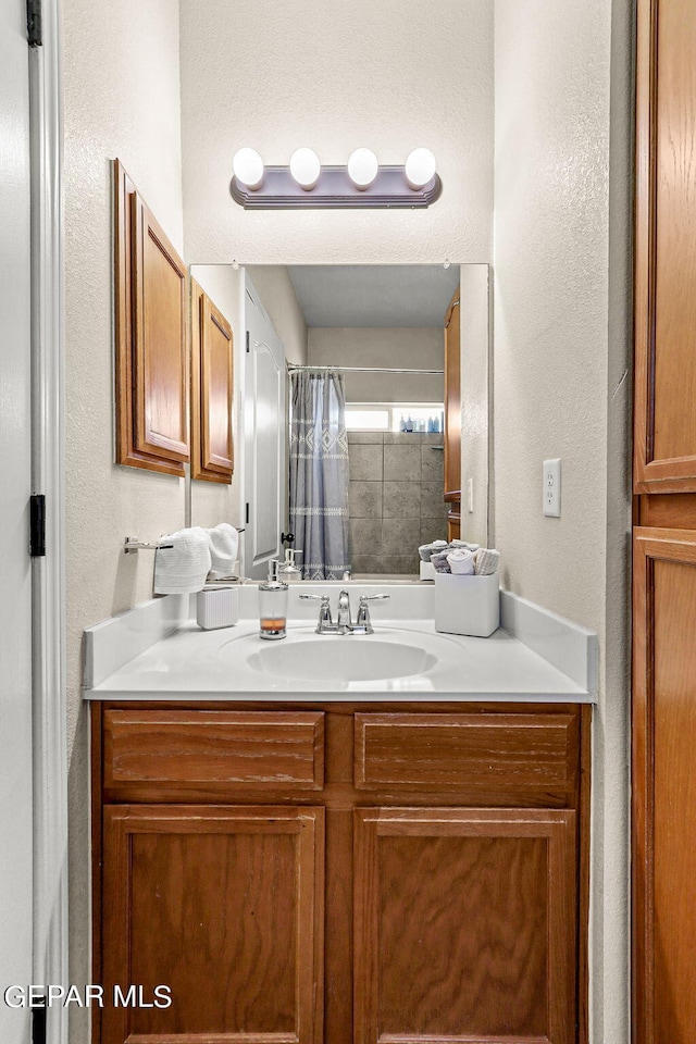 bathroom with vanity and a shower with curtain