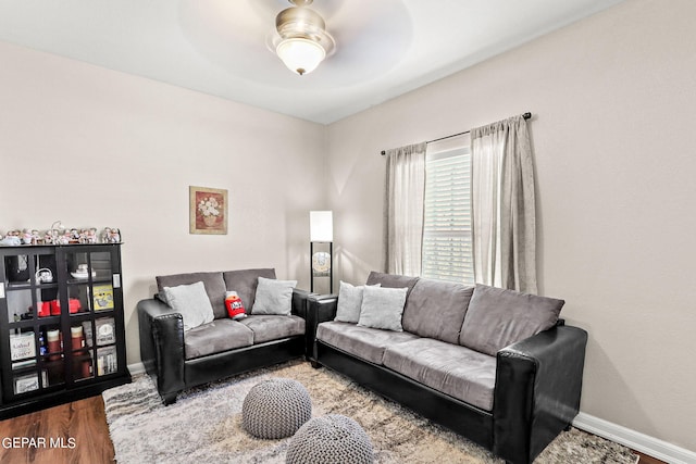 living room with ceiling fan and hardwood / wood-style floors