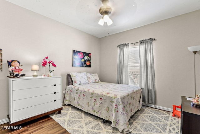 bedroom featuring hardwood / wood-style flooring and ceiling fan