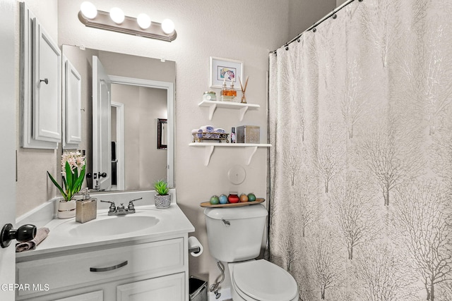 bathroom with vanity, toilet, and a shower with curtain