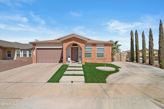 view of front of house featuring a front lawn and a garage