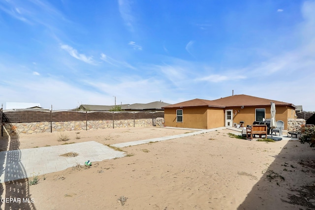 rear view of property with a patio area