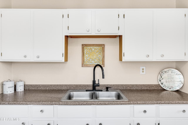 kitchen with sink and white cabinets