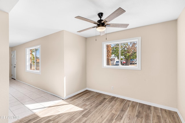 empty room featuring light hardwood / wood-style floors and ceiling fan