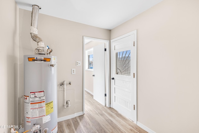 utility room with gas water heater