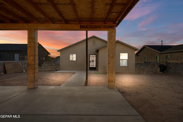 view of patio terrace at dusk