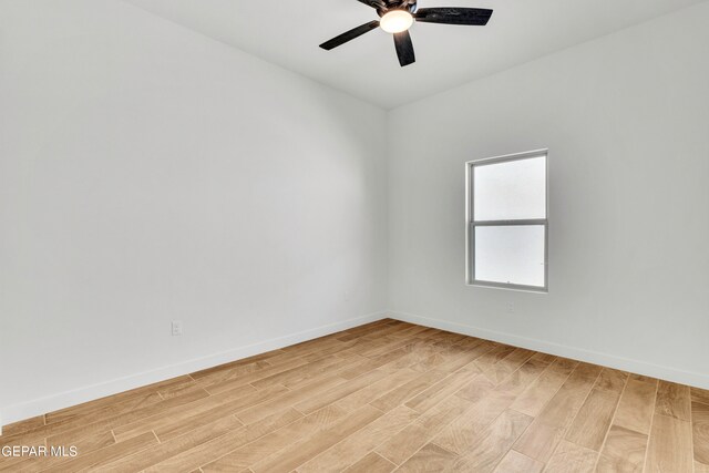 spare room featuring light hardwood / wood-style floors and ceiling fan