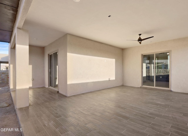 view of patio featuring ceiling fan