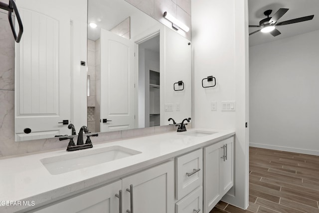 bathroom with vanity, hardwood / wood-style flooring, and ceiling fan