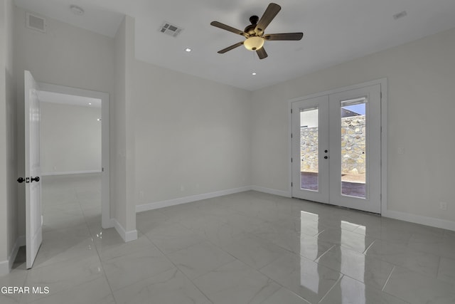 spare room with french doors and ceiling fan