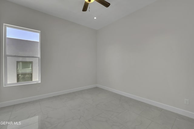 spare room featuring ceiling fan