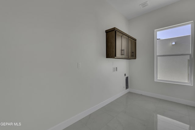 laundry area with washer hookup, cabinets, and electric dryer hookup