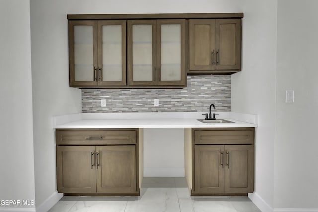 kitchen featuring sink and backsplash