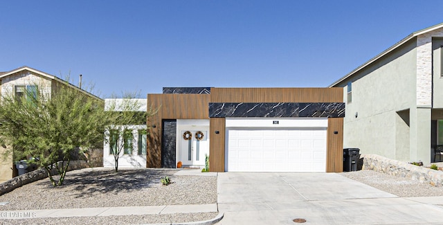 341 Sleepy Run St, El Paso, TX 79928 - contemporary home with concrete driveway and an attached garage