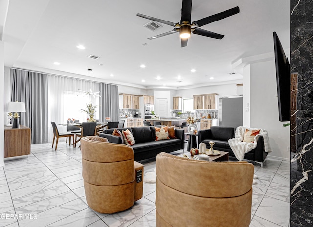 341 Sleepy Run St, El Paso, TX 79928 - living room with light marble finish flooring, a ceiling fan, and recessed lighting