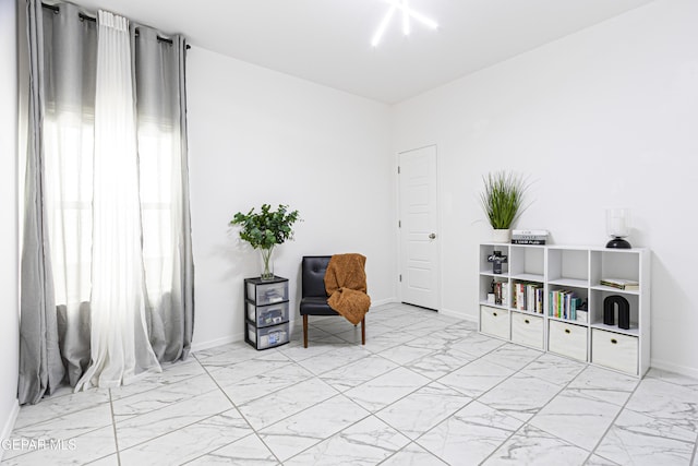 341 Sleepy Run St, El Paso, TX 79928 - sitting room featuring marble look tiles and baseboards