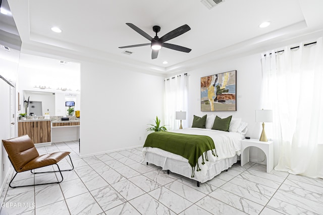 341 Sleepy Run St, El Paso, TX 79928 - bedroom featuring a tray ceiling, light marble finish floors, recessed lighting, ensuite bath, and a ceiling fan