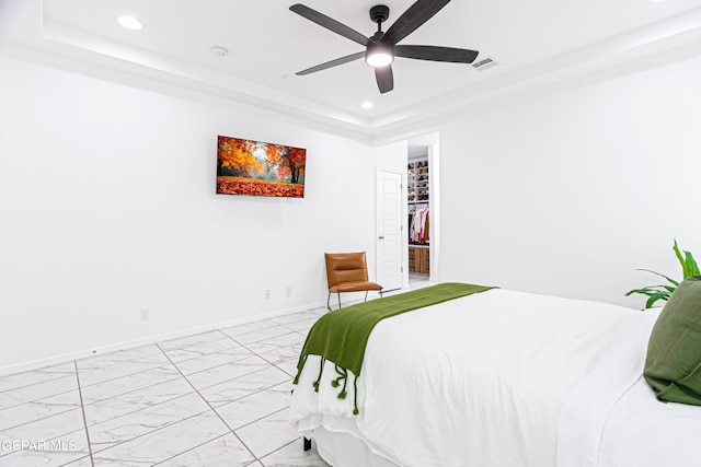 341 Sleepy Run St, El Paso, TX 79928 - bedroom with recessed lighting, light marble finish floors, a raised ceiling, baseboards, and ceiling fan