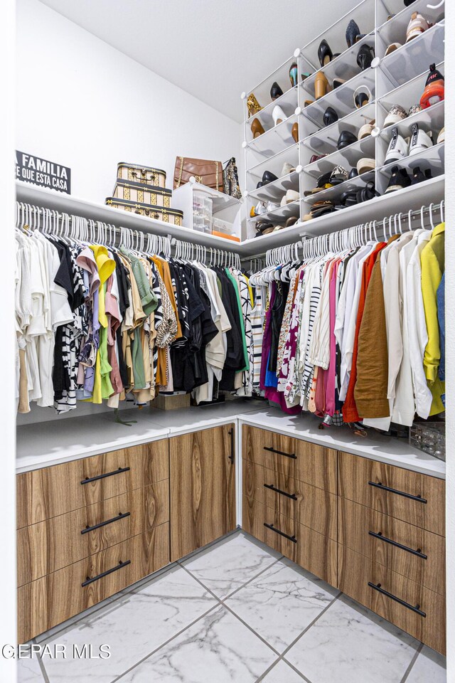 341 Sleepy Run St, El Paso, TX 79928 - walk in closet with light marble finish flooring and lofted ceiling