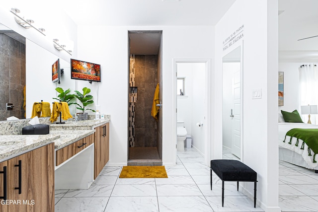 341 Sleepy Run St, El Paso, TX 79928 - bathroom featuring marble finish floors, toilet, and a stall shower