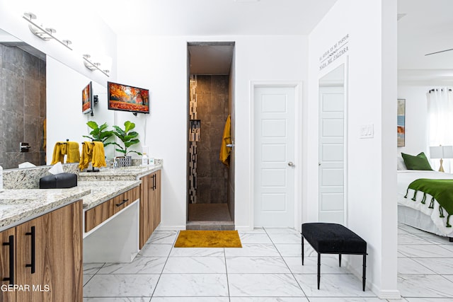 341 Sleepy Run St, El Paso, TX 79928 - full bath with marble look tile flooring, vanity, a walk in shower, and baseboards