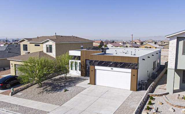 341 Sleepy Run St, El Paso, TX 79928 - view of front of house featuring driveway, a residential view, and central AC unit